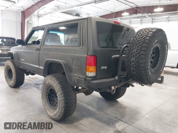 1999 Jeep Cherokee SE z VIN 1J4FF27S0XL575410, wystawiony jako IAAI lot #42787311 z przebiegiem 174 830 mil mil oraz . Historia ofert i sprzedaży dostępna na DreamBid. Obrazek 3.