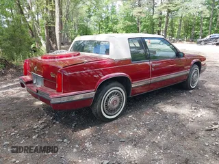 1990 Cadillac Eldorado z VIN 1G6EL1333LU608572, wystawiony jako IAAI lot #42191060 z przebiegiem 105 433 mil mil oraz . Historia ofert i sprzedaży dostępna na DreamBid. Obrazek 4.