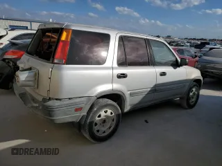 1999 Honda CR-V LX with VIN JHLRD2848XC011581, listed as a Copart auction lot 77183294 with 218,474 mi miles and Salvage Title. Bid and sale history available at carsss.com. Image 3.