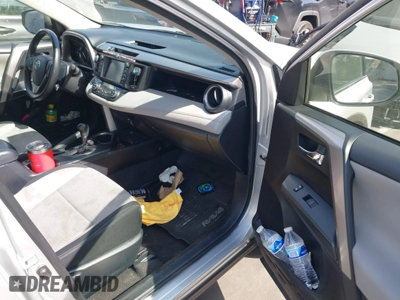 2016 Toyota RAV4 Hybrid XLE with VIN JTMRJREVXGD029019, listed as a IAAI auction lot 42021530 with 74,400 mi miles. Bid and sale history available at carsss.com. Image 5.