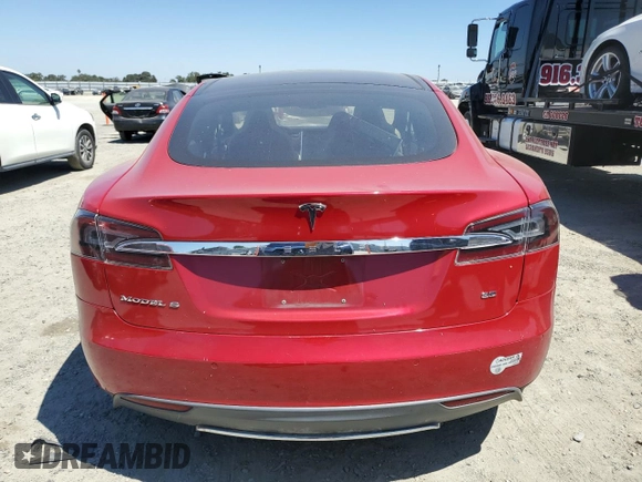 2014 Tesla Model S 60 with VIN 5YJSA1H17EFP64266, listed as a Copart auction lot 61678485 with 104,160 mi miles and Salvage title. Bid and sale history available at DreamBid. Image 6.