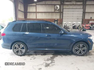 2022 BMW X7 xDrive40i z VIN 5UXCW2C06N9J14282, wystawiony jako IAAI lot #42122751 z przebiegiem 16 896 mil mil oraz . Historia ofert i sprzedaży dostępna na DreamBid. Obrazek 13.