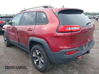 2015 Jeep Cherokee Trailhawk with VIN 1C4PJMBS6FW575517, listed as a IAAI auction lot 42661199 with 299,166 mi miles and . Bid and sale history available at DreamBid. Image 3.