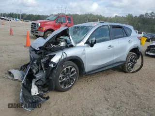 2016 Mazda CX-5 Grand Touring z VIN JM3KE2DY7G0737848, wystawiony jako Copart lot #57608215 z przebiegiem Nie podano mil oraz Szkoda całkowita • Salvage title. Historia ofert i sprzedaży dostępna na DreamBid. Obrazek 1.