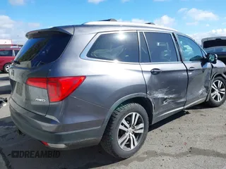 2017 Honda Pilot EX-L with VIN 5FNYF6H57HB021350, listed as a IAAI auction lot 41673635 with 101,980 mi miles and . Bid and sale history available at DreamBid. Image 4.