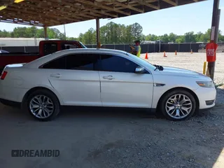 2015 Ford Taurus Limited z VIN 1FAHP2F89FG101017, wystawiony jako IAAI lot #42284459 z przebiegiem 183 167 mil mil oraz . Historia ofert i sprzedaży dostępna na DreamBid. Obrazek 13.
