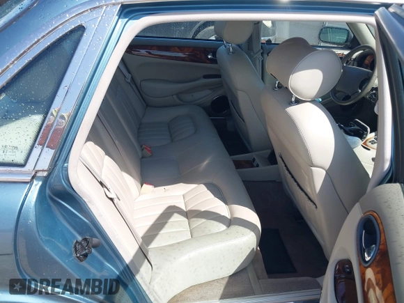 1998 Jaguar XJ with VIN SAJHX1241WC819418, listed as a IAAI auction lot 42456539 with 126,457 mi miles and . Bid and sale history available at DreamBid. Image 8.