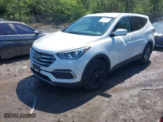 2018 Hyundai Santa Fe Sport 2.4L with VIN 5NMZT3LB7JH091203, listed as a IAAI auction lot 41983942 with 124,285 mi miles. Bid and sale history available at carsss.com. Image 2.