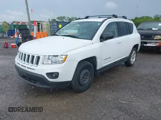 2011 Jeep Compass Latitude with VIN 1J4NT1FB1BD192076, listed as a IAAI auction lot 42121930 with 148,548 mi miles. Bid and sale history available at carsss.com. Image 2.