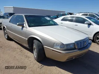 2001 Cadillac Eldorado Touring ETC z VIN 1G6ET12971B109319, wystawiony jako IAAI lot #41682779 z przebiegiem 147 515 mil mil oraz . Historia ofert i sprzedaży dostępna na DreamBid. Obrazek 1.
