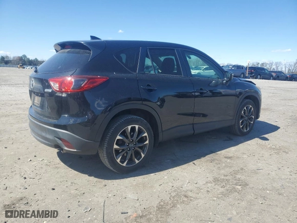 2016 Mazda CX-5 Grand Touring with VIN JM3KE4DYXG0713796, listed as a Copart auction lot 50717055 with 216,170 mi miles and Salvage Title. Bid and sale history available at carsss.com. Image 3.