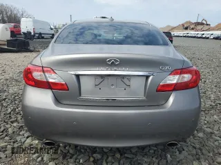 2014 Infiniti Q70 z VIN JN1BY1AP5EM260240, wystawiony jako Copart lot #53209505 z przebiegiem 72 105 mil mil oraz Tytuł czysty. Historia ofert i sprzedaży dostępna na DreamBid. Obrazek 6.