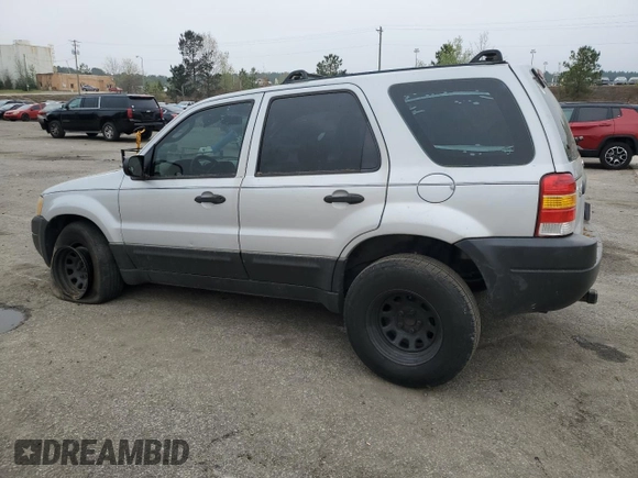 2003 Ford Escape XLS Popular with VIN 1FMYU02173KB43156, listed as a Copart auction lot 51534495 with 266,600 mi miles and Salvage title. Bid and sale history available at DreamBid. Image 2.