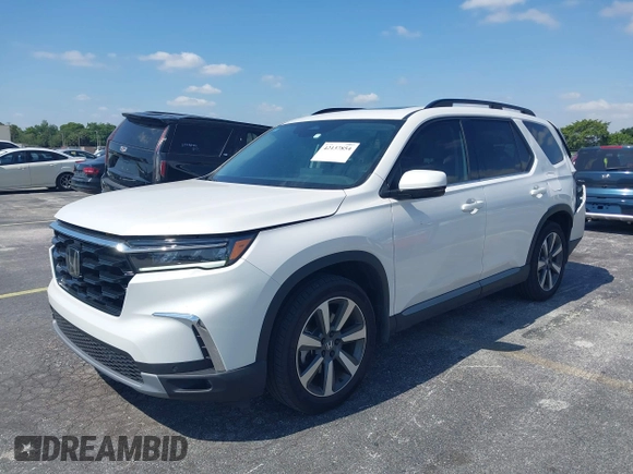 2024 Honda Pilot Touring z VIN 5FNYG2H72RB016937, wystawiony jako IAAI lot #42137854 z przebiegiem 18 028 mil mil oraz . Historia ofert i sprzedaży dostępna na DreamBid. Obrazek 17.