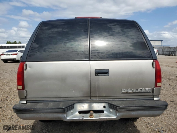 1999 Chevrolet Tahoe Z71 with VIN 1GNEK13R0XJ444734, listed as a Copart auction lot 76323384 with 160,631 mi miles and Salvage Title. Bid and sale history available at carsss.com. Image 6.