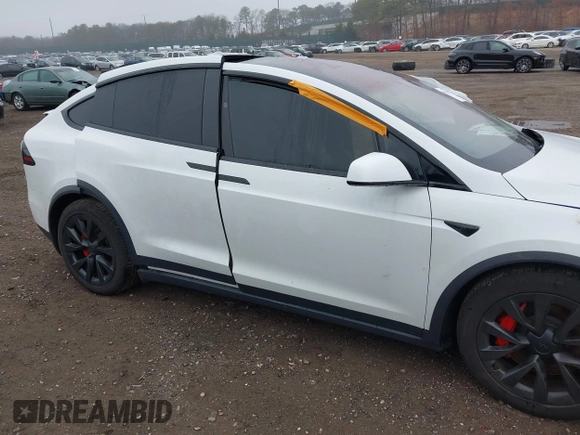 2022 Tesla Model X Plaid z VIN 7SAXCBE67NF339557, wystawiony jako IAAI lot #41825360 z przebiegiem 70 mil mil oraz . Historia ofert i sprzedaży dostępna na DreamBid. Obrazek 6.