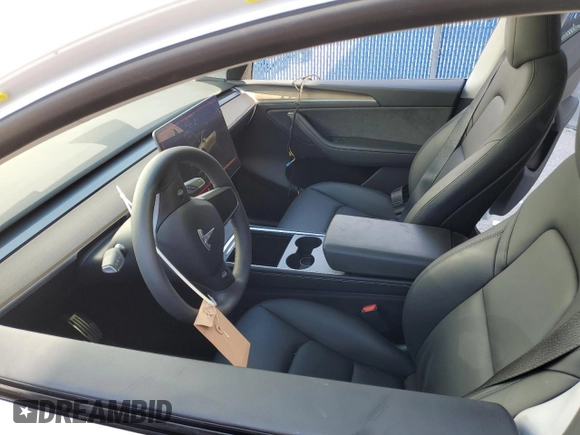 2024 Tesla Model Y Long Range with VIN 7SAYGDEEXRA288960, listed as a Copart auction lot 60801525 with 18,942 mi miles and Salvage title. Bid and sale history available at DreamBid. Image 7.