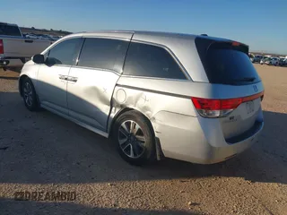 2014 Honda Odyssey Touring with VIN 5FNRL5H97EB094353, listed as a IAAI auction lot 41701712 with 141,228 mi miles and . Bid and sale history available at DreamBid. Image 3.