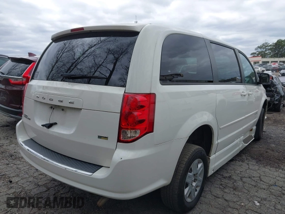 2012 Dodge Grand Caravan SE with VIN 2C4RDGBG9CR232038, listed as a IAAI auction lot 41823766 with 77,468 mi miles and . Bid and sale history available at DreamBid. Image 4.