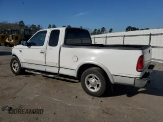 2000 Ford F-150 XL with VIN 1FTRX17L1YNA26050, listed as a Copart auction lot 43597105 with 205,152 mi miles and Salvage Title. Bid and sale history available at carsss.com. Image 2.