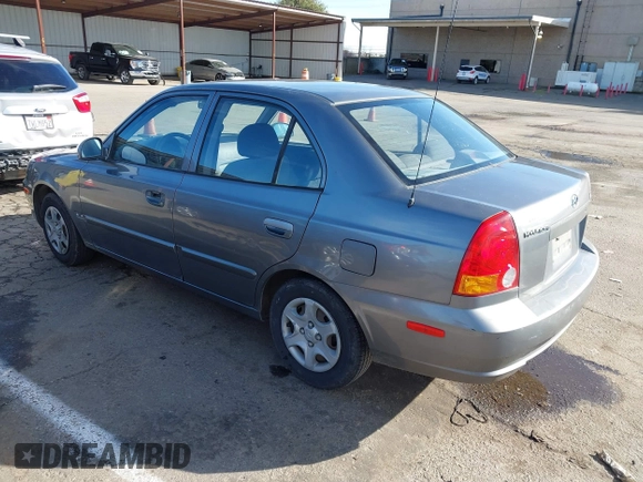 2004 Hyundai Accent GL with VIN KMHCG45C04U531177, listed as a IAAI auction lot 41526033 with 126,102 mi miles. Bid and sale history available at carsss.com. Image 3.