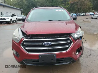 2018 Ford Escape SE z VIN 1FMCU9GD4JUA49819, wystawiony jako Copart lot #73023734 z przebiegiem 96 228 mil mil oraz Szkody całkowita. Historia ofert i sprzedaży dostępna na DreamBid. Obrazek 5.