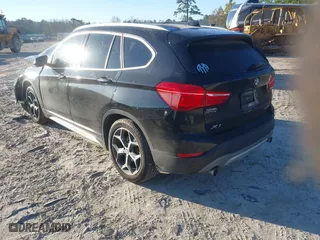 2019 BMW X1 sDrive28i with VIN WBXHU7C52K5L11560, listed as a IAAI auction lot 41354422 with 115,401 mi miles. Bid and sale history available at carsss.com. Image 3.