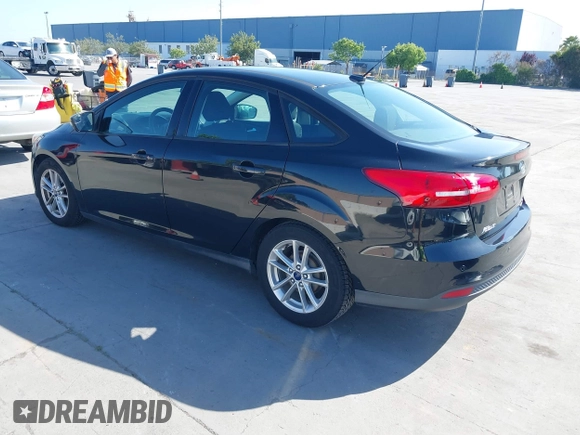 2015 Ford Focus SE with VIN 1FADP3F23FL313614, listed as a IAAI auction lot 42153320 with 121,346 mi miles. Bid and sale history available at carsss.com. Image 3.