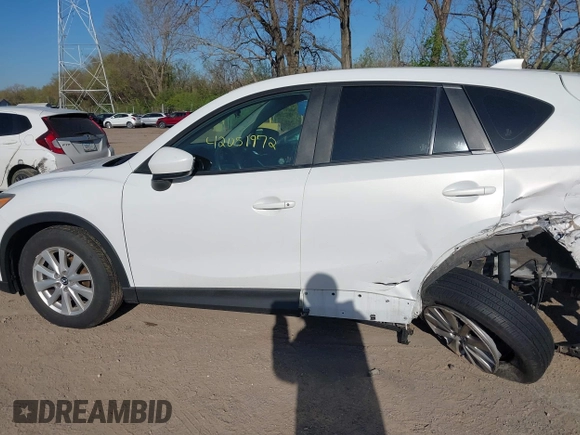 2014 Mazda CX-5 Sport with VIN JM3KE2BE8E0301175, listed as a IAAI auction lot 42051972 with 121,821 mi miles and . Bid and sale history available at carsss.com. Image 14.