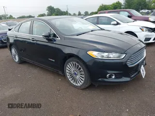 2014 Ford Fusion Titanium Hybrid with VIN 3FA6P0RU9ER354091, listed as a IAAI auction lot 42645564 with 93,210 mi miles and . Bid and sale history available at DreamBid. Image 1.
