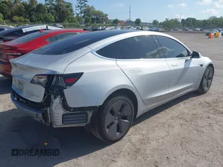 2018 Tesla Model 3 Long Range Battery with VIN 5YJ3E1EB7JF104356, listed as a IAAI auction lot 41936961 with 90,932 mi miles and . Bid and sale history available at DreamBid. Image 4.