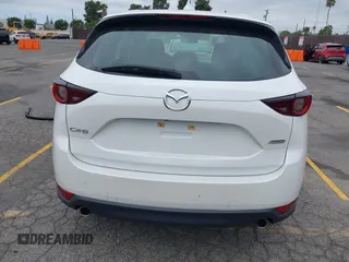 2019 Mazda CX-5 Sport with VIN JM3KFABM4K1565787, listed as a IAAI auction lot 42054585 with 80,580 mi miles and . Bid and sale history available at DreamBid. Image 16.