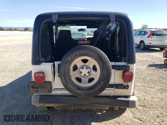 2006 Jeep Wrangler Sport Right Hand Drive with VIN 1J4F449S76P747454, listed as a Copart auction lot 77819214 with 184,763 mi miles and Salvage Title. Bid and sale history available at carsss.com. Image 6.