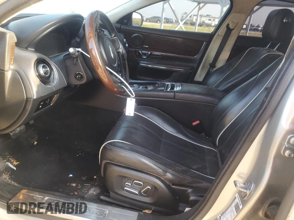 2014 Jaguar XJ Portfolio with VIN SAJWJ2GD7E8V61558, listed as a Copart auction lot 66850034 with 130,984 mi miles and Salvage title. Bid and sale history available at DreamBid. Image 7.
