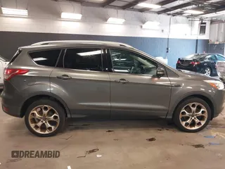 2014 Ford Escape Titanium with VIN 1FMCU9JX0EUE45254, listed as a IAAI auction lot 42038700 with 60,103 mi miles. Bid and sale history available at carsss.com. Image 13.