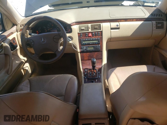2001 Mercedes-Benz E-Class AWD with VIN WDBJH82J91X057063, listed as a Copart auction lot 70235274 with 174,846 mi miles and Salvage Title. Bid and sale history available at carsss.com. Image 8.