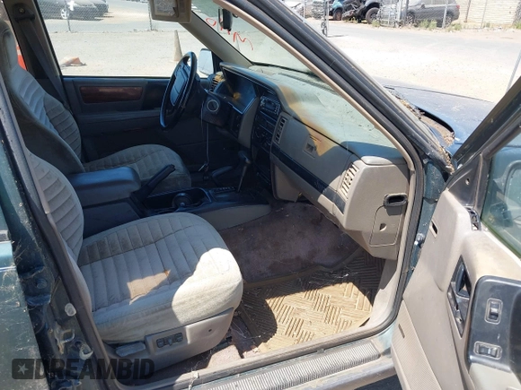 1994 Jeep Grand Cherokee Laredo with VIN 1J4GZ58S2RC118502, listed as a IAAI auction lot 42701778 with 420,559 mi miles and . Bid and sale history available at DreamBid. Image 5.