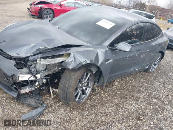 2023 Tesla Model 3 with VIN 5YJ3E1EAXPF693693, listed as a IAAI auction lot 41709704 with 12,473 mi miles and . Bid and sale history available at DreamBid. Image 6.