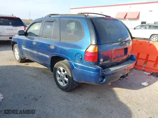 2006 GMC Envoy SLE with VIN 1GKDS13SX62315193, listed as a IAAI auction lot 41866029 with 231,164 mi miles. Bid and sale history available at carsss.com. Image 3.