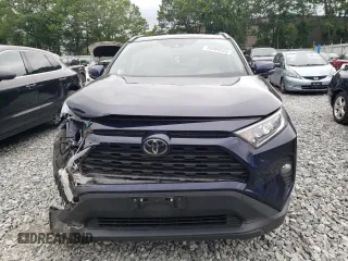 2019 Toyota RAV4 XLE with VIN JTMP1RFV4KD037700, listed as a Copart auction lot 60989525 with 110,577 mi miles and Salvage title. Bid and sale history available at DreamBid. Image 5.