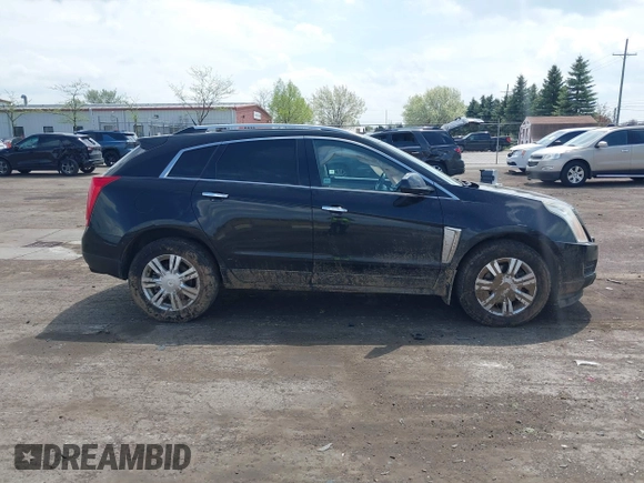 2014 Cadillac SRX Luxury Collection z VIN 3GYFNEE32ES659705, wystawiony jako IAAI lot #42148269 z przebiegiem 140 560 mil mil oraz . Historia ofert i sprzedaży dostępna na DreamBid. Obrazek 13.