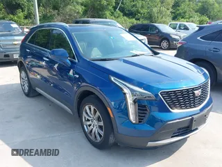 2019 Cadillac XT4 FWD Premium Luxury z VIN 1GYFZCR44KF144295, wystawiony jako IAAI lot #42273524 z przebiegiem 68 736 mil mil oraz . Historia ofert i sprzedaży dostępna na DreamBid. Obrazek 1.