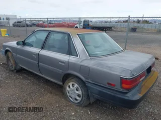 1990 Toyota Camry DLX z VIN 4T1SV21EXLU271320, wystawiony jako IAAI lot #41798353 z przebiegiem 269 178 mil mil oraz . Historia ofert i sprzedaży dostępna na DreamBid. Obrazek 3.