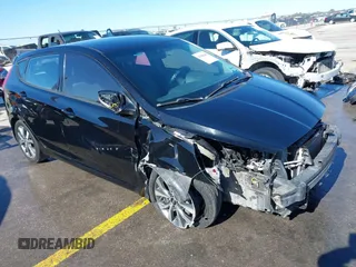 2015 Hyundai Accent Sport with VIN KMHCU5AE8FU233131, listed as a IAAI auction lot 41360461 with 99,480 mi miles. Bid and sale history available at carsss.com. Image 1.