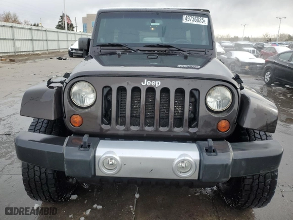 2013 Jeep Wrangler Unlimited Sahara with VIN 1C4BJWEG2DL649933, listed as a Copart auction lot 49736025 with 173,157 mi miles and Salvage Title. Bid and sale history available at carsss.com. Image 5.