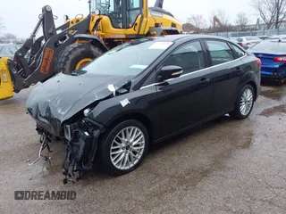 2014 Ford Focus Titanium with VIN 1FADP3J25EL310199, listed as a IAAI auction lot 40682901 with 84,885 mi miles and . Bid and sale history available at DreamBid. Image 2.