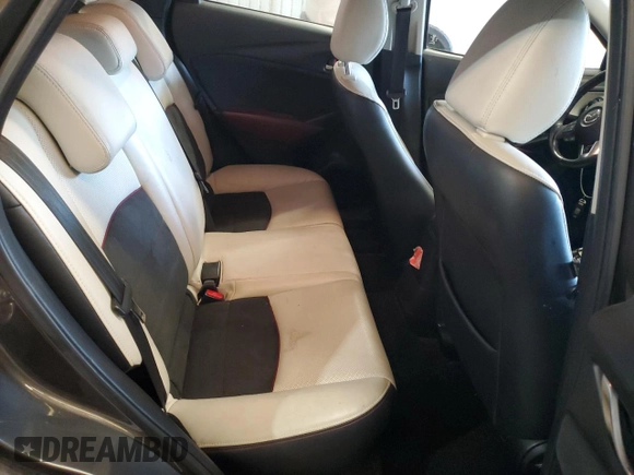 2016 Mazda CX-3 Grand Touring z VIN JM1DKFD74G0137815, wystawiony jako Copart lot #52405765 z przebiegiem 128 922 mil mil oraz Szkoda całkowita • Salvage title. Historia ofert i sprzedaży dostępna na DreamBid. Obrazek 10.
