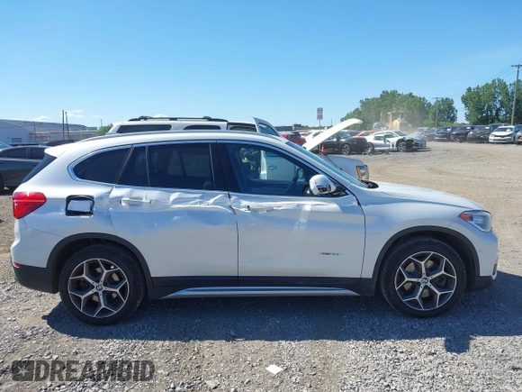 2017 BMW X1 xDrive28i z VIN WBXHT3C32H5F83287, wystawiony jako IAAI lot #42791160 z przebiegiem 69 006 mil mil oraz . Historia ofert i sprzedaży dostępna na DreamBid. Obrazek 13.