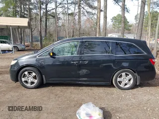 2013 Honda Odyssey Touring with VIN 5FNRL5H96DB003796, listed as a IAAI auction lot 41828376 with 6,308 mi miles and . Bid and sale history available at carsss.com. Image 14.
