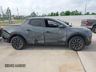 2022 Hyundai Santa Cruz SEL with VIN 5NTJBDAE4NH022823, listed as a IAAI auction lot 42051616 with 23,158 mi miles and . Bid and sale history available at DreamBid. Image 13.